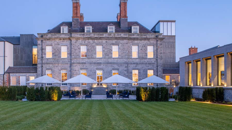 Front view of hotel and gardens