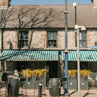 View of the ELY Wine Store and outside seating area from the street