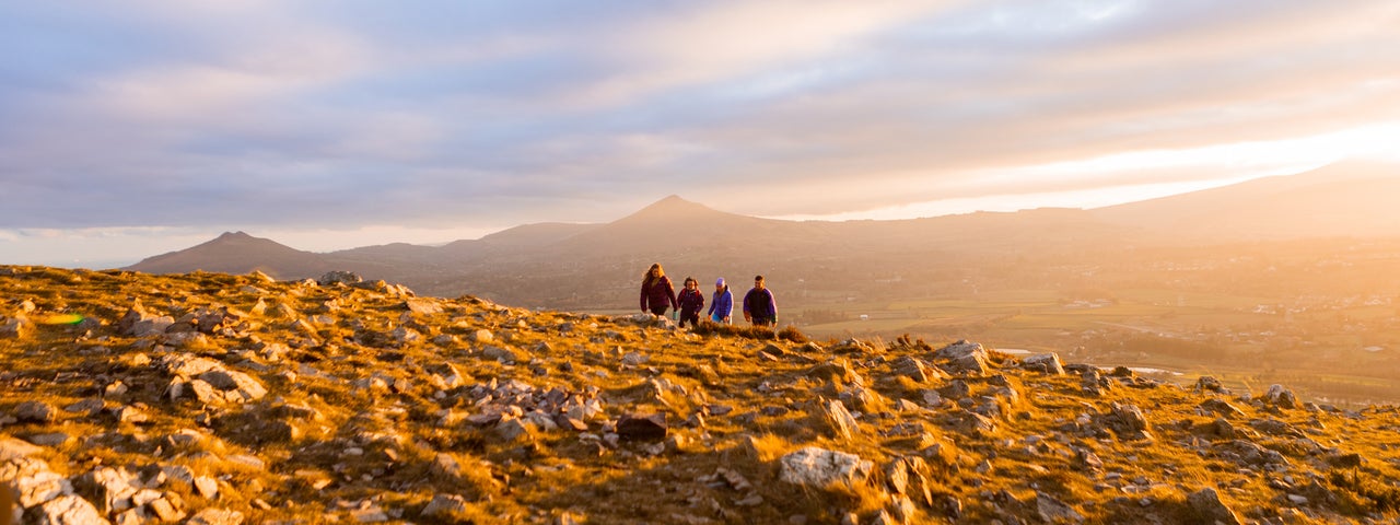 Walkers at sunset, Hilltoptreks, Dublin