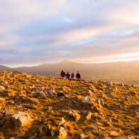 Walkers at sunset, Hilltoptreks, Dublin