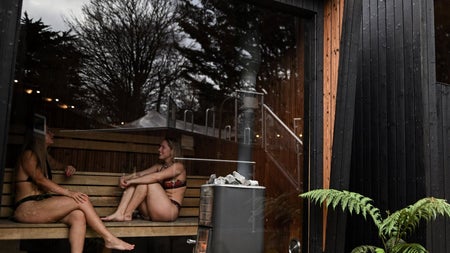 Two girls sitting inside a sauna at The Hot Box Sauna Inchicore
