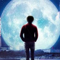 Moonlight - The Philip Lynott Enigma - Rear view of a man walking on cobbled path, silhouetted against a large, bright moon