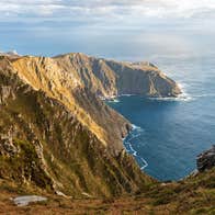 A hiker at Sliabh Liag (Slieve League) cliffs in Co Donegal