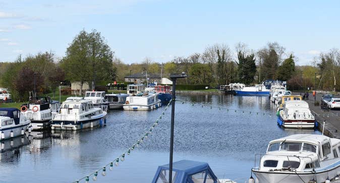 Cruiser boats moored by a marina