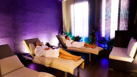 Two robed ladies relax in the Tranquillity Room at Buff Day Spa
