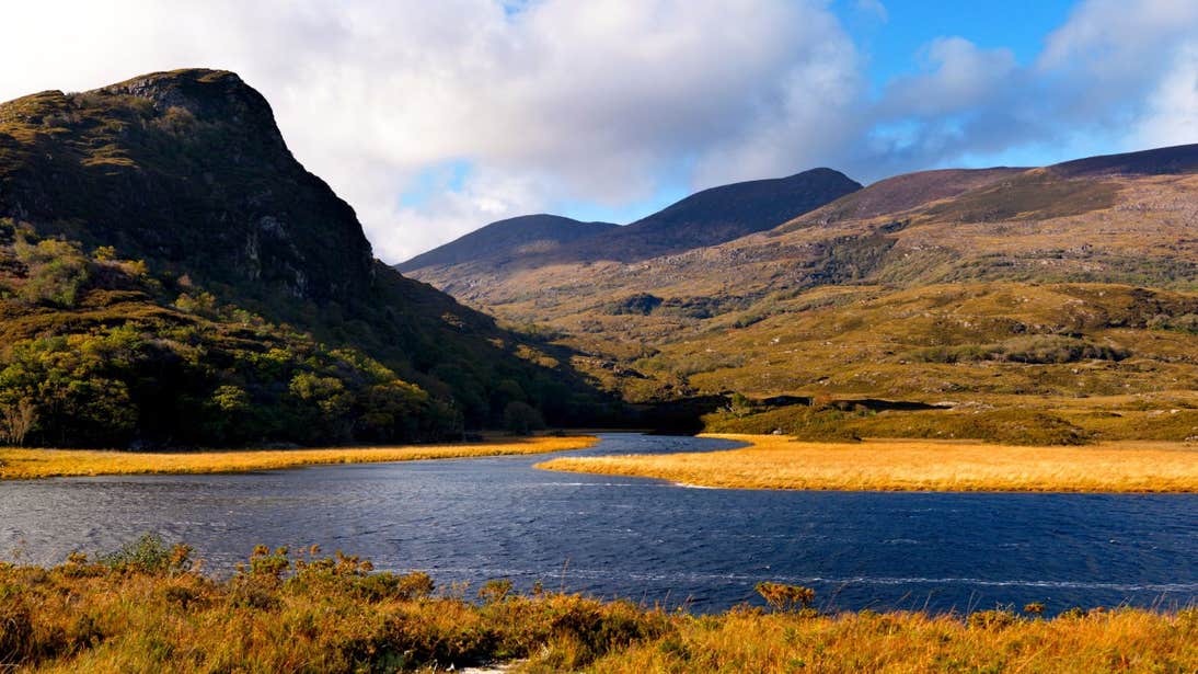 A lake near a mountain in Killarney National Park