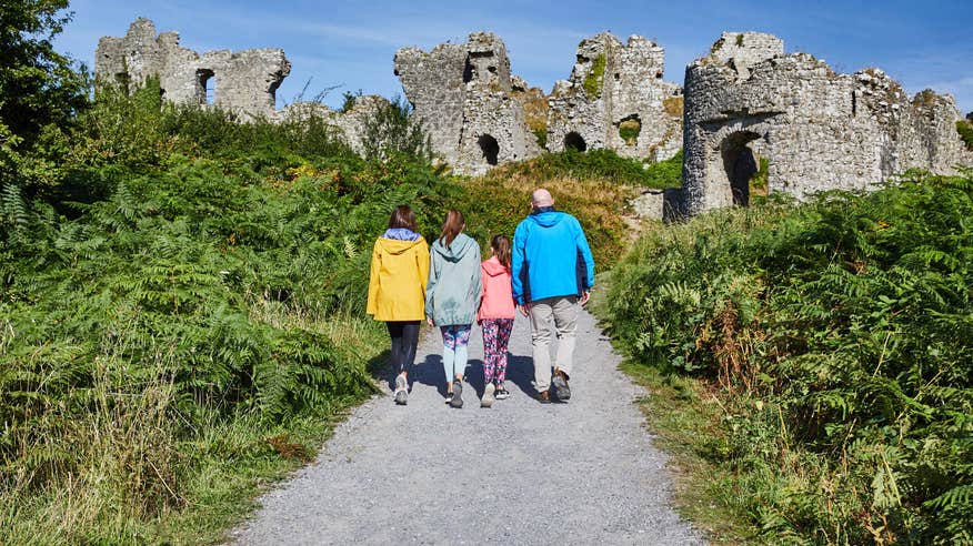 Family walking up to the Rock of Dunamase.