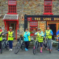 A group of people with Loop Head e bikes outside the Long Dock bar