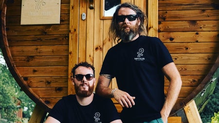 Two men outside an Irish Sweat House outdoor sauna