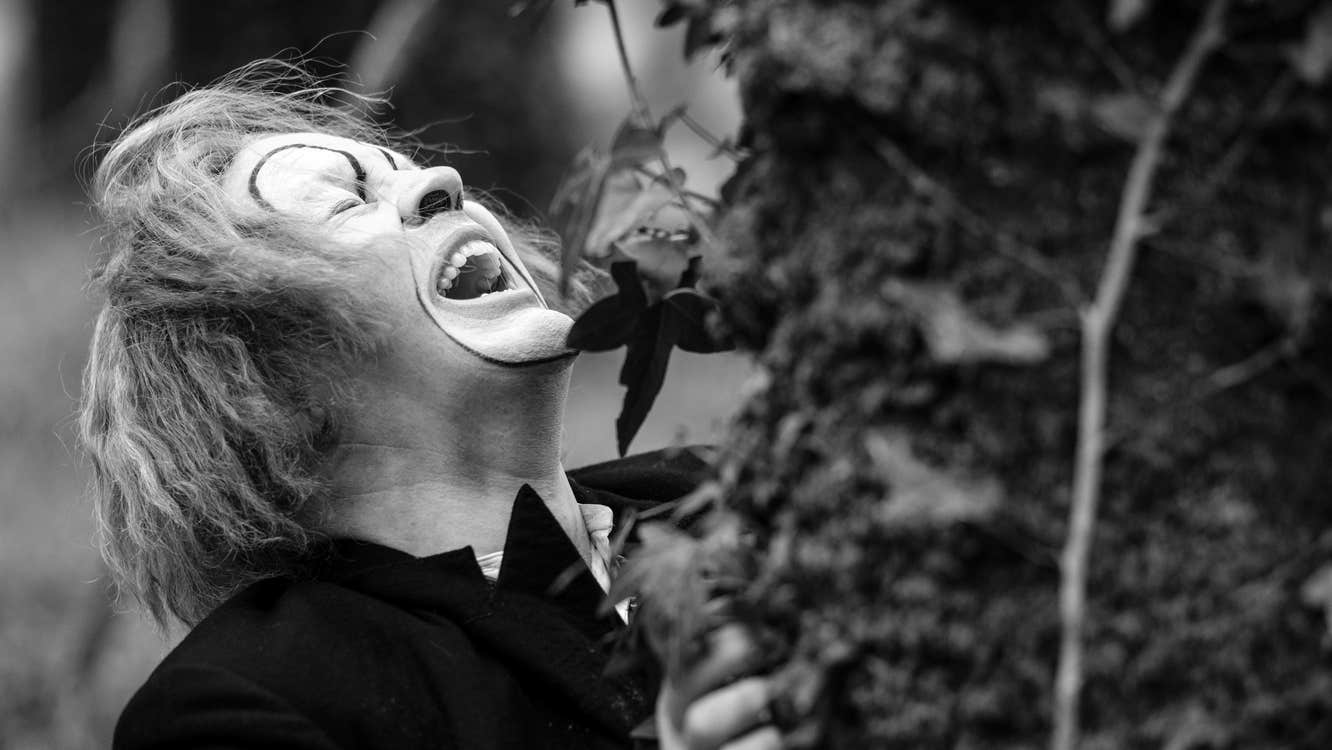 A clown who is either wailing or laughing.