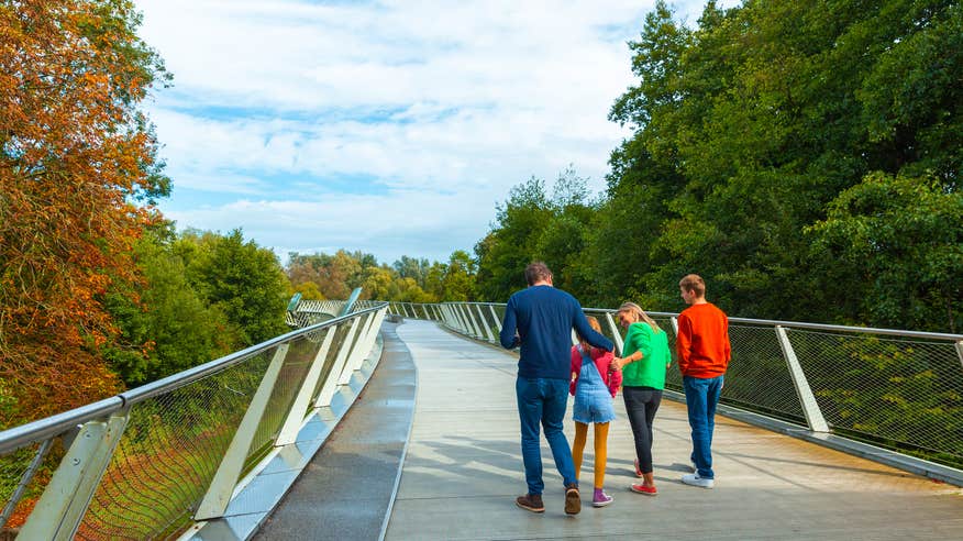 A family walking along The Living Bridge in Limerick.