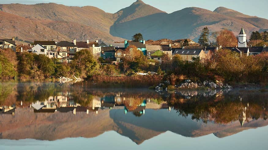 An image of houses and buildings reflected in the water at Sneem, Co. Kerry