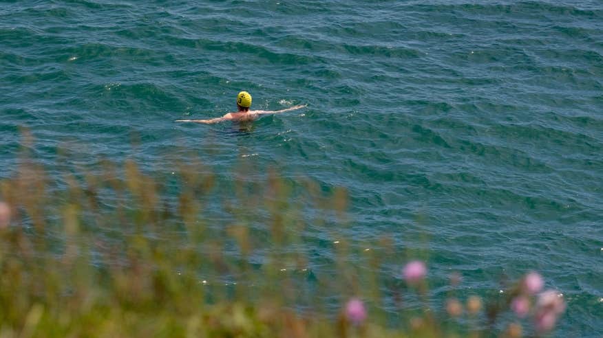 Person swimming in the sea at Brittas Bay in Wicklow