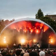 Trinity Summer Series 2026 - view of a dome shaped outdoor music stage with large audience