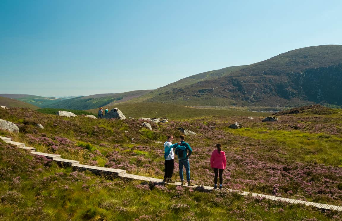 People hiking the Glendalough Trail in Wicklow National Park in Co Wicklow