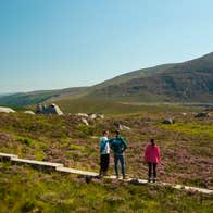 People hiking the Glendalough Trail in Wicklow National Park in Co Wicklow