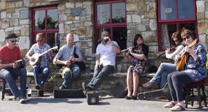 Musicians playing outside The Singing Pub