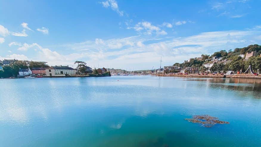 A view of Kinsale Harbour, colourful houses and a blue sky