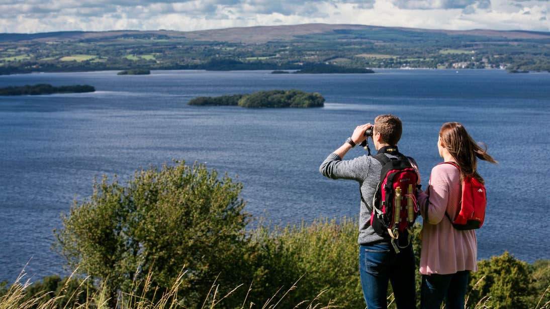 A man and a woman admiring the stunning views of Lough Derg