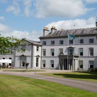 A large period house overlooking a well maintained lawn
