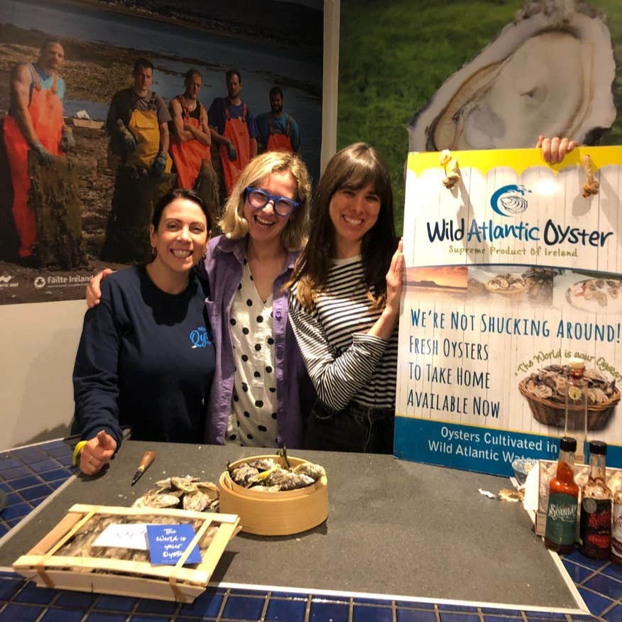 Three women smiling at Wild Atlantic Oyster Experience.