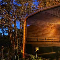 A lakeside sauna by night