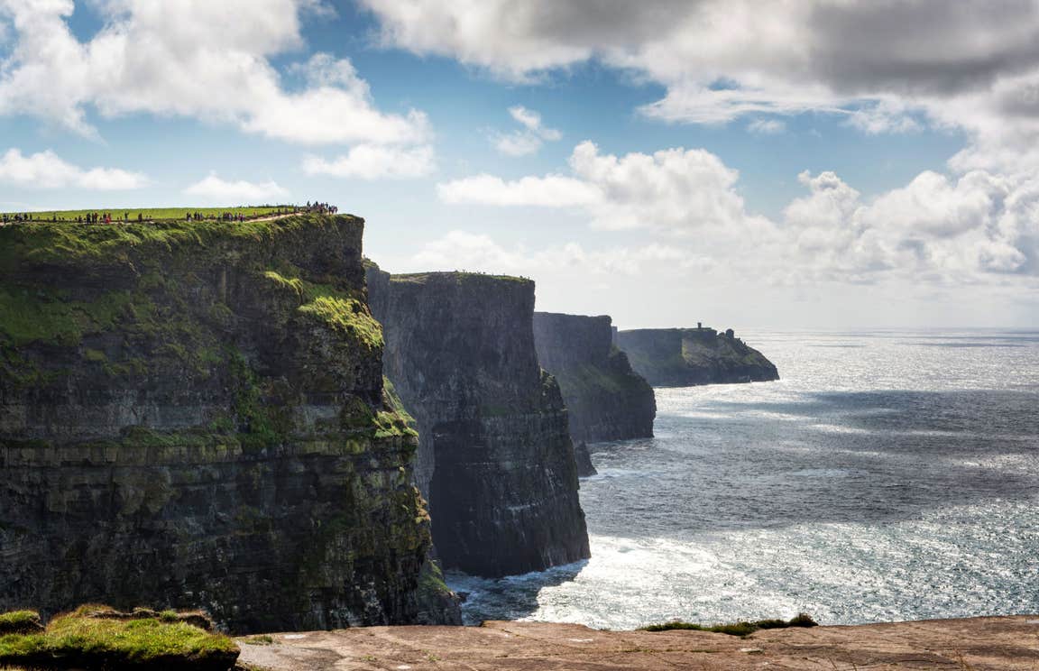 Sunny day with some low lying clouds at Cliffs of Moher, County Clare