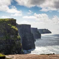 Sunny day with some low lying clouds at Cliffs of Moher, County Clare