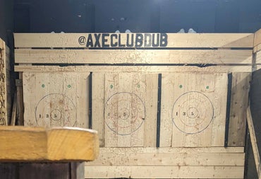 Targets for axe throwing on three wooden boards