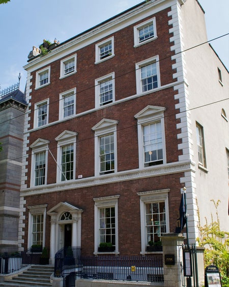 A tall Georgian building with red brick