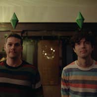 Two men with polyhedrons over their heads.