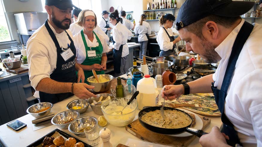 People taking a cooking class at the Ballymaloe Cookery School.