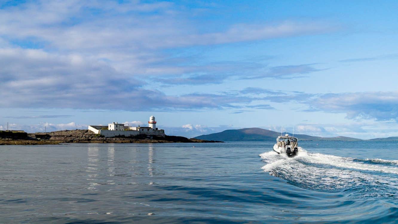 A view of Valentia Lighthouse with Valentia Island Experience - AquaTerra Boat Tours