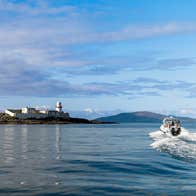 A view of Valentia Lighthouse with Valentia Island Experience - AquaTerra Boat Tours