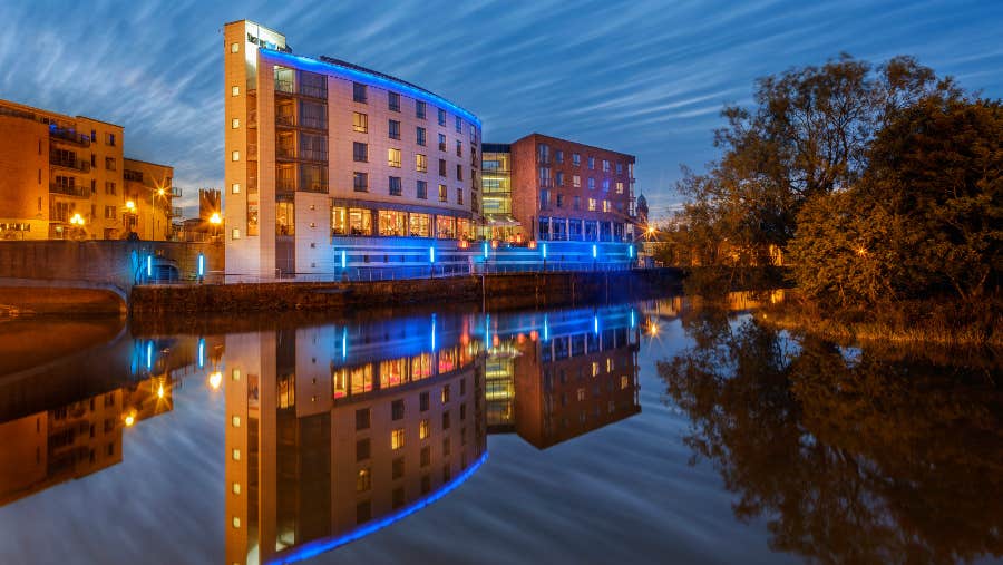 exterior of the hotel with view of river