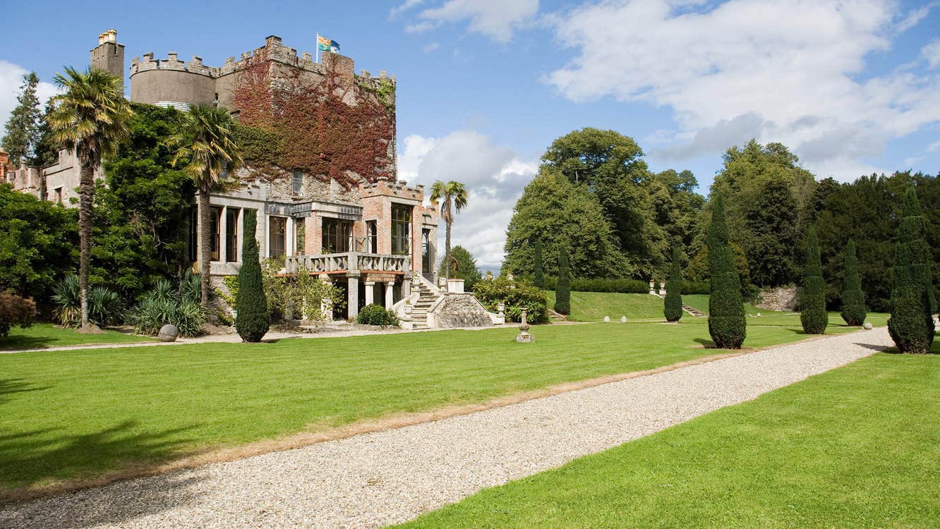 Exterior photo of Huntington Castle and Gardens with blue skies