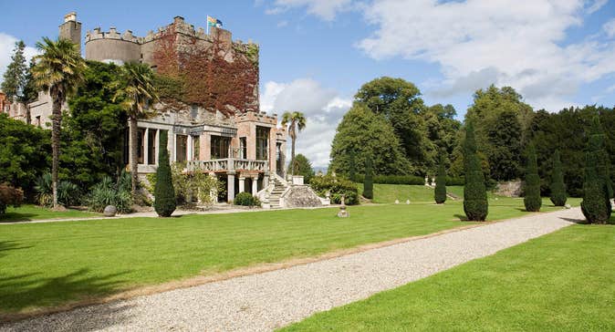 Exterior photo of Huntington Castle and Gardens with blue skies