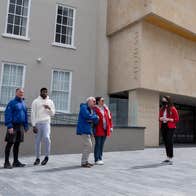 A group with a tour guide outside Waterford Treasures Museums