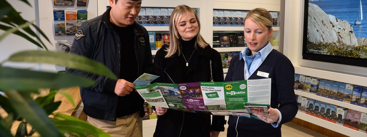 A member of staff at Dublin Tourist Information Centre Barnardo Square assisting visitors