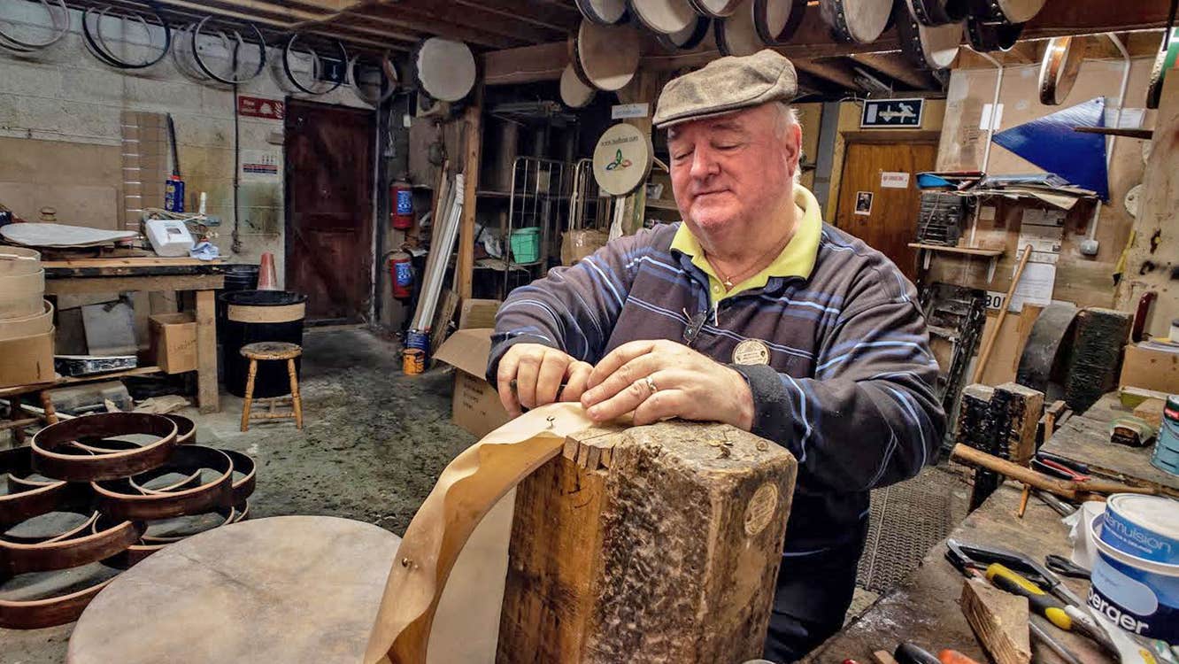 Roundstone Music and Crafts showing a man in a workshop making a bodhran