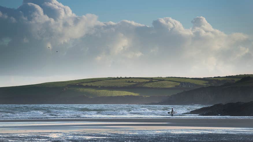 A surfer on Inchydoney Beach in West Cork