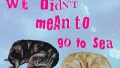 Part of poster in pale blue with text and 2 hand drawn images of dogs asleep.