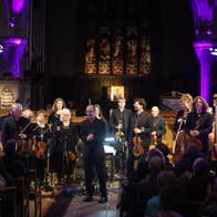 The Luminosa String Orchestra standing after their performance at St Nicholas' Collegiate Church, Galway