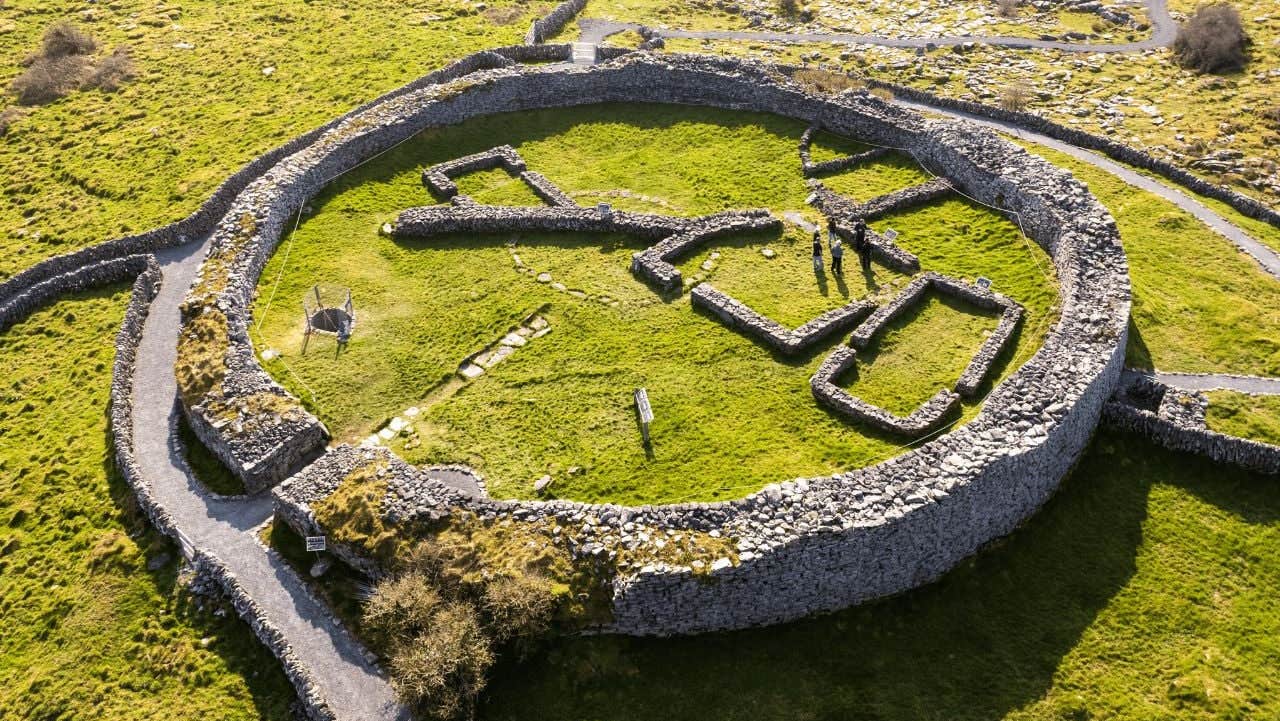 Aerial view of a stone ring fort surrounded by fields