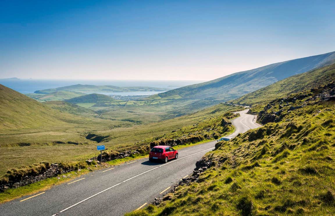 Car driving on the road on the Connor Pass, County Kerry