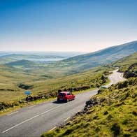 Car driving on the road on the Connor Pass, County Kerry