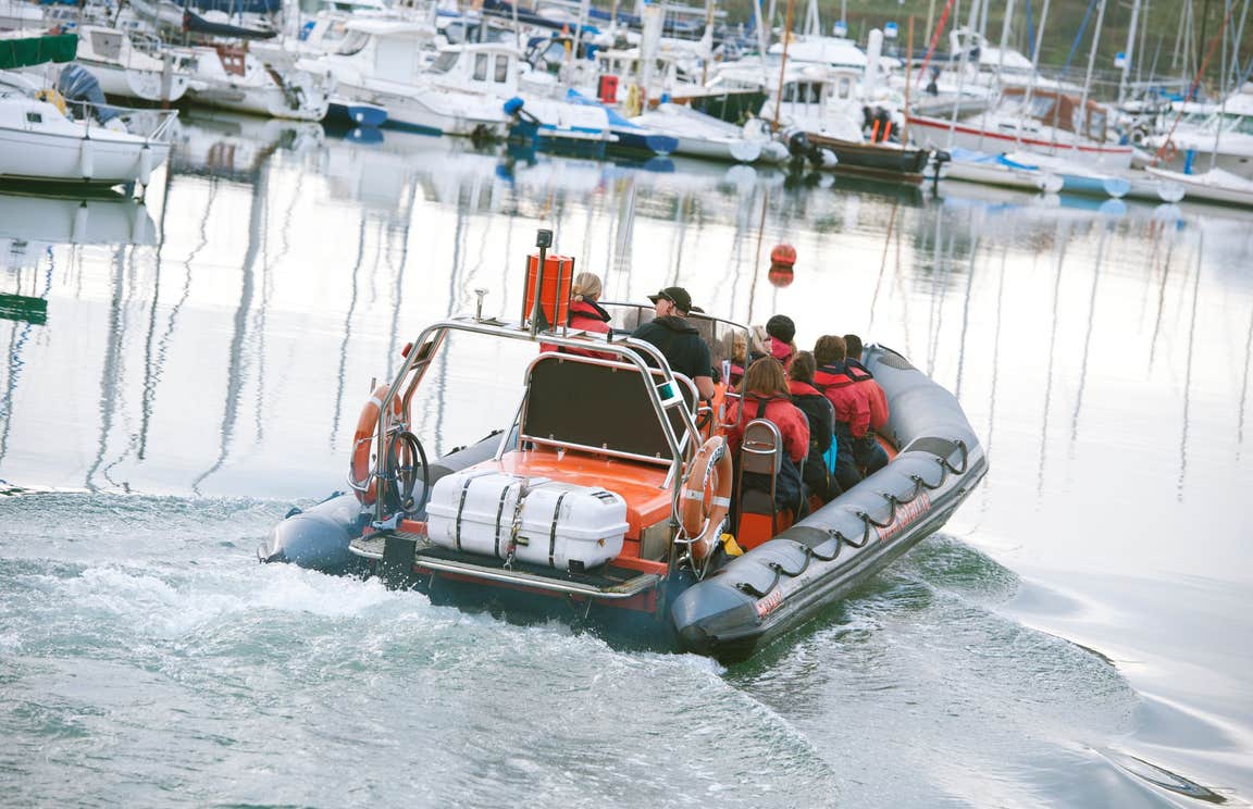 A group of people on a boat at Kinsale Harbour in County Cork