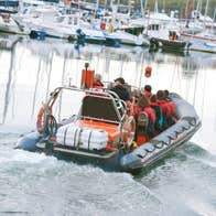 A group of people on a boat at Kinsale Harbour in County Cork