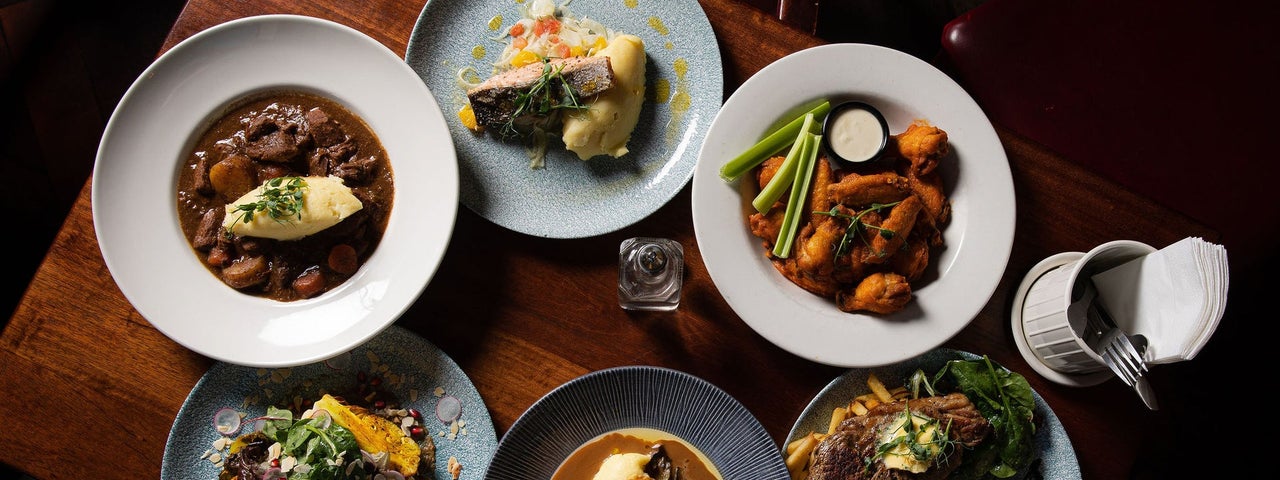 A selection of main courses on a table served at Nancy Hands Bar & Restaurant