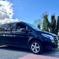 Black Mercedes tour bus